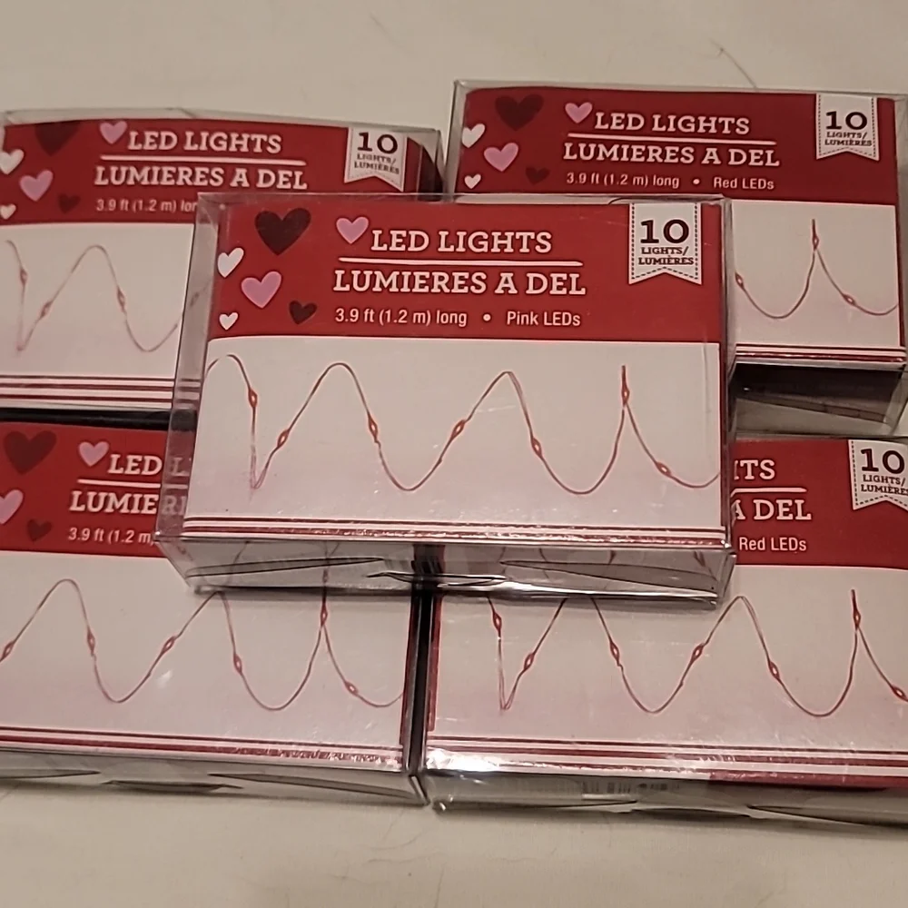 Lot of 7 pink and/or red mini led lights.
